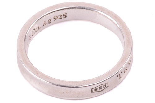Lot 148 - Tiffany & Co. - a narrow 1837 ring, with...