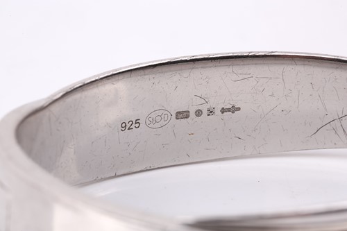 Lot 181 - Montblanc - a silver hinged bangle, with an...