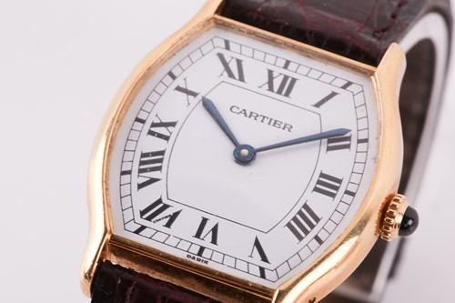 Lot 400 - Cartier. An 18 carat gold Tortue watch. The...