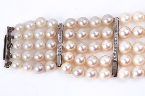 Lot 262 - A five-row graduated pearl bracelet with...
