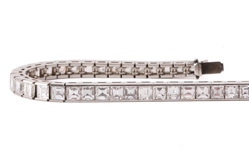 Lot 278 - A diamond line bracelet, incorporating...