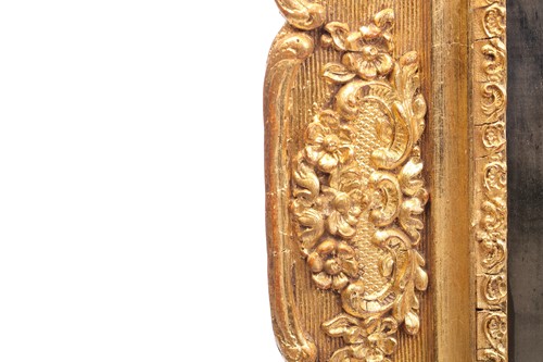 Lot 151 - A 19th-century moulded and gilt plaster mirror...