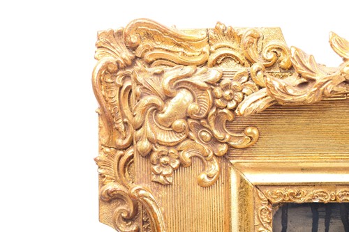 Lot 151 - A 19th-century moulded and gilt plaster mirror...