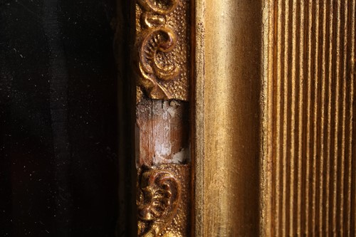 Lot 151 - A 19th-century moulded and gilt plaster mirror...