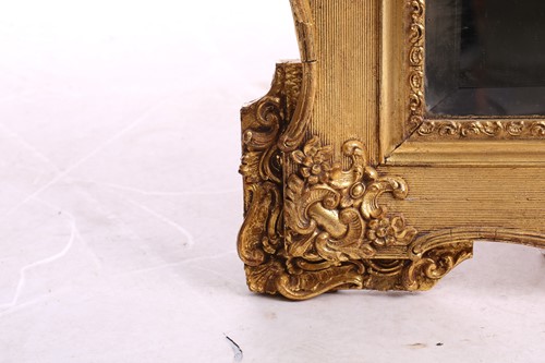 Lot 151 - A 19th-century moulded and gilt plaster mirror...