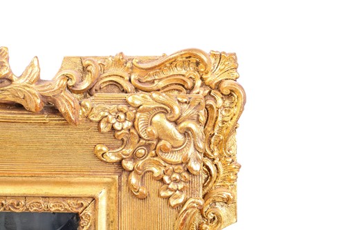 Lot 151 - A 19th-century moulded and gilt plaster mirror...