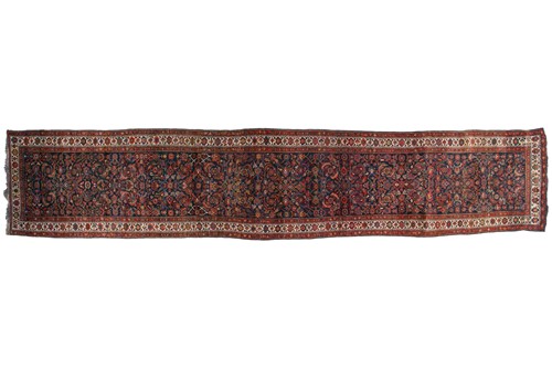 Lot 153 - A long antique Bidjar runner with Herat motif...