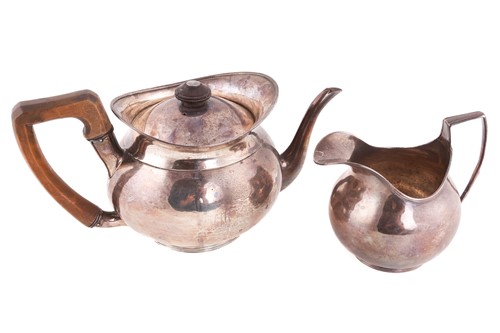 Lot 437 - A George III silver teapot and cream jug, by...