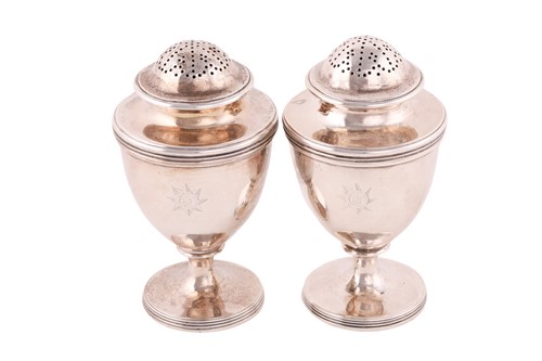 Lot 472 - A pair of George III silver pepperettes, by...