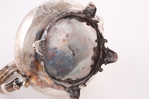 Lot 489 - A Victorian Rococo style silver teapot, by...