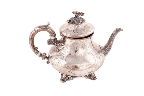 Lot 489 - A Victorian Rococo style silver teapot, by...