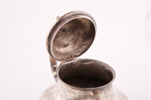 Lot 489 - A Victorian Rococo style silver teapot, by...