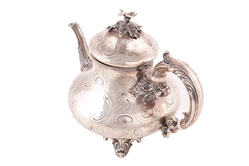Lot 489 - A Victorian Rococo style silver teapot, by...