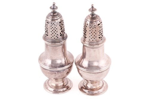 Lot 477 - A pair of George III silver sugar casters,...