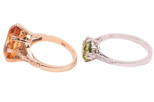Lot 169 - A peridot solitaire ring and a citrine ring in...