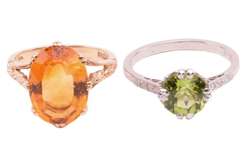 Lot 169 - A peridot solitaire ring and a citrine ring in...