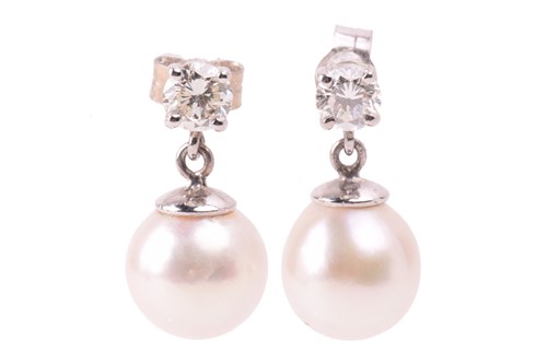 Lot 221 - A pair of diamond and pearl drop earrings in...