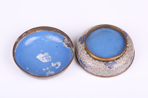 Lot 118 - A Chinese-turned translucent light green Jade...