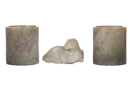 Lot 118 - A Chinese-turned translucent light green Jade...