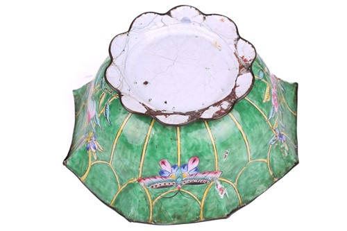 Lot 118 - A Chinese-turned translucent light green Jade...