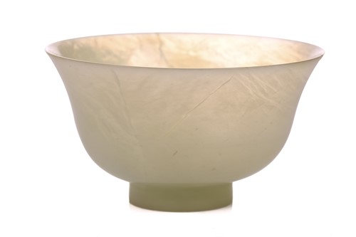 Lot 118 - A Chinese-turned translucent light green Jade...