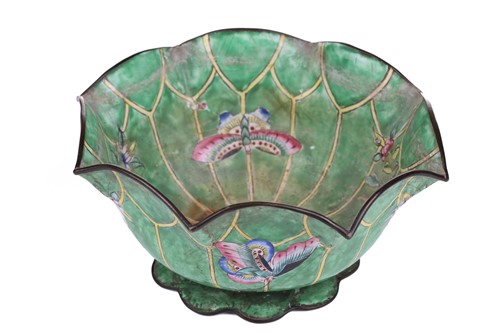 Lot 118 - A Chinese-turned translucent light green Jade...