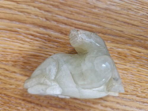 Lot 118 - A Chinese-turned translucent light green Jade...