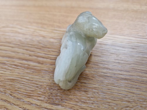 Lot 118 - A Chinese-turned translucent light green Jade...