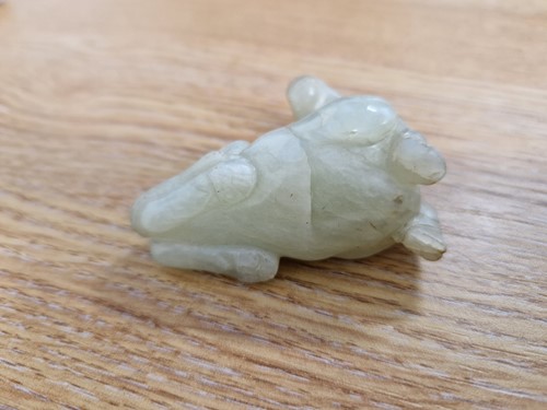 Lot 118 - A Chinese-turned translucent light green Jade...
