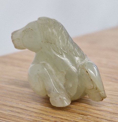 Lot 118 - A Chinese-turned translucent light green Jade...