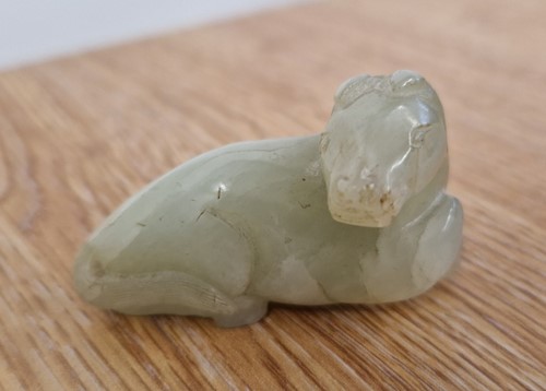 Lot 118 - A Chinese-turned translucent light green Jade...