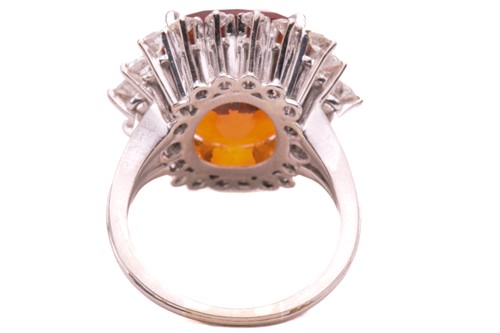 Lot 85 - A citrine and diamond ring, set with a central...