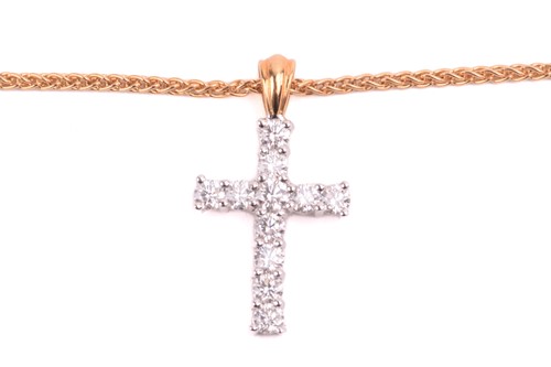 Lot 5 - A diamond cross pendant, set with round...