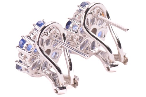 Lot 168 - A pair of sapphire and diamond flowerhead...