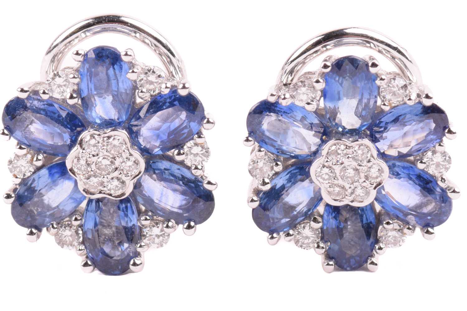 Lot 168 - A pair of sapphire and diamond flowerhead...