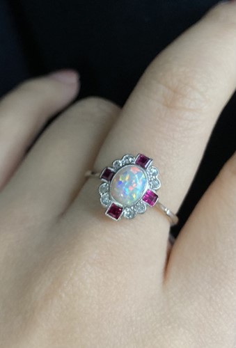 Lot 221 - An Art Deco opal, ruby and diamond dress ring,...