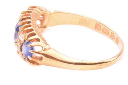 Lot 163 - An Edwardian sapphire and diamond half hoop...