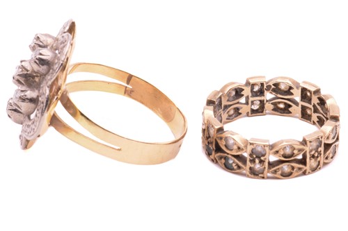 Lot 99 - A diamond flowerhead ring and another; the...