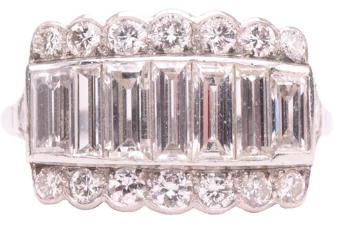 Lot 249 - A diamond ring, set with a central row of...