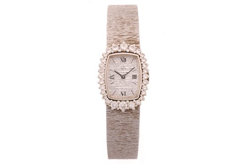 Lot 419 - A Uti diamond set dress watch featuring a...