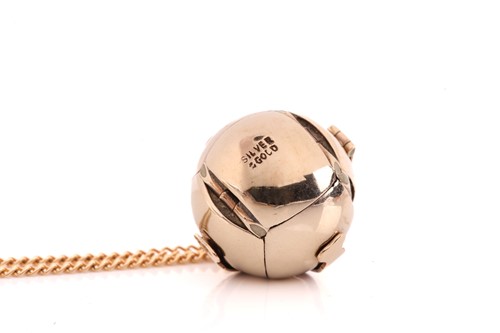 Lot 136 - A silver gilt Masonic orb charm on chain, with...