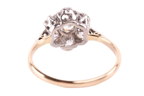Lot 218 - A diamond daisy head cluster ring, featuring...