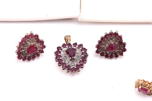 Lot 264 - Twelve pairs of earrings and a ruby set...