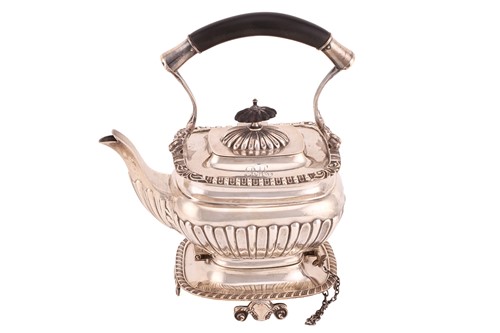 Lot 505 - An Edwardian silver teapot and stand, of...