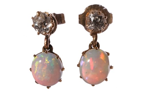 Lot 110 - A pair of diamond and opal drop earrings, each...