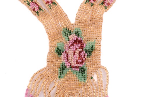 Lot 210 - A 1920's beaded sautoir necklace with a rose...