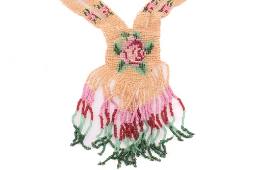 Lot 210 - A 1920's beaded sautoir necklace with a rose...