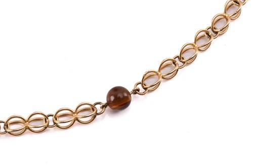 Lot 64 - A cage link necklace with tiger's eye bead...