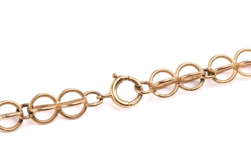 Lot 64 - A cage link necklace with tiger's eye bead...