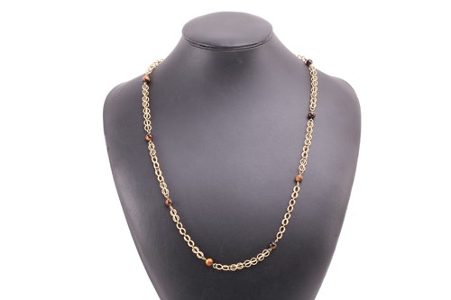 Lot 64 - A cage link necklace with tiger's eye bead...